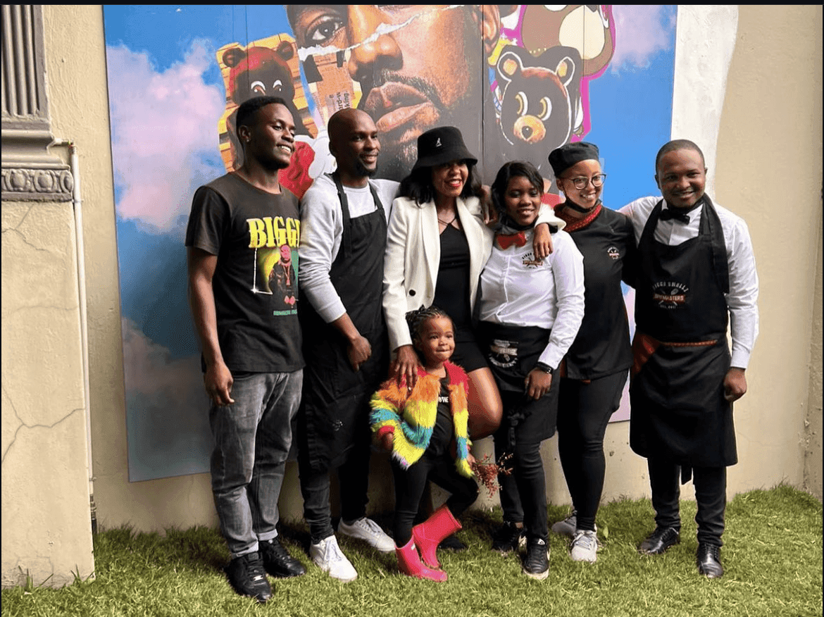 The team with a young guest and her family at a private catered event.